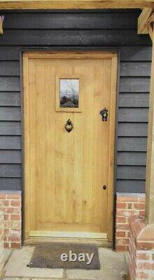 External Suffolk Oak front door with rectangular or diamond unglazed window