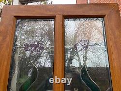 UPVC front door with a lovely tinted windows Roses? Pattern Oak Like Exterior